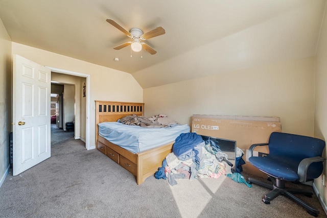 carpeted bedroom with baseboards, ceiling fan, and vaulted ceiling