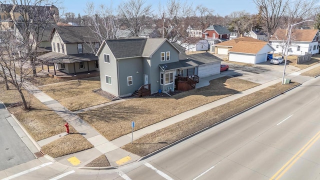 birds eye view of property with a residential view