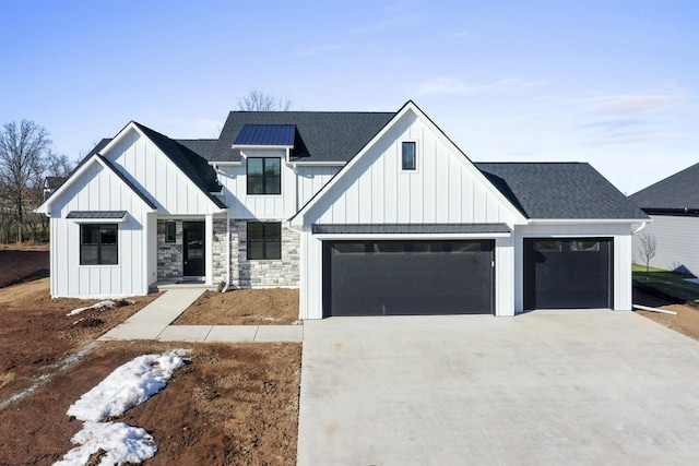 modern inspired farmhouse featuring concrete driveway, a garage, board and batten siding, and roof with shingles