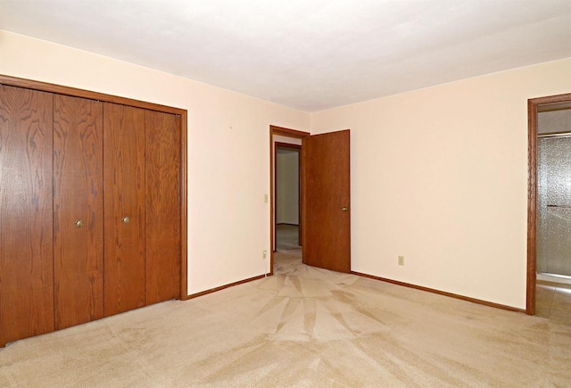 2325 Stuart Ct, Madison, WI 53704 - unfurnished bedroom featuring baseboards, carpet, and a closet