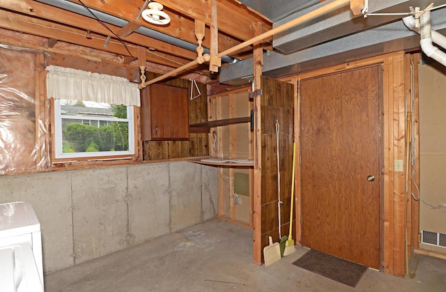 2325 Stuart Ct, Madison, WI 53704 - below grade area featuring visible vents and washer / dryer