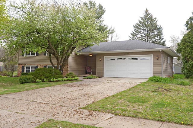 2325 Stuart Ct, Madison, WI 53704 - view of front of house with a garage and driveway