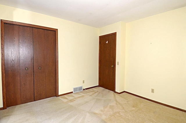 2325 Stuart Ct, Madison, WI 53704 - unfurnished bedroom with light colored carpet, baseboards, and visible vents