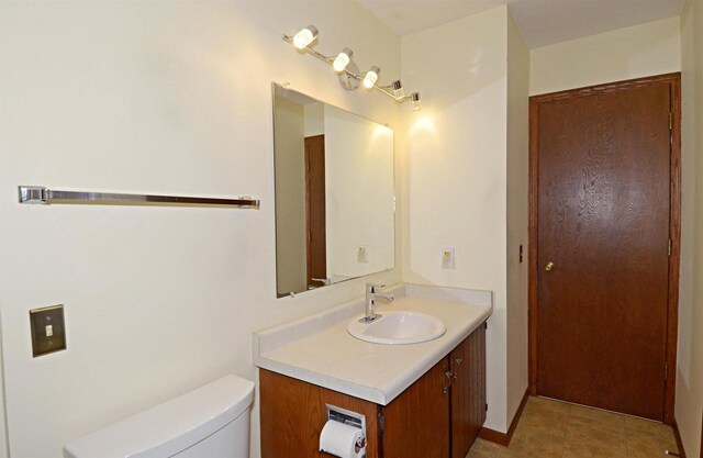2325 Stuart Ct, Madison, WI 53704 - bathroom with vanity, tile patterned flooring, and toilet