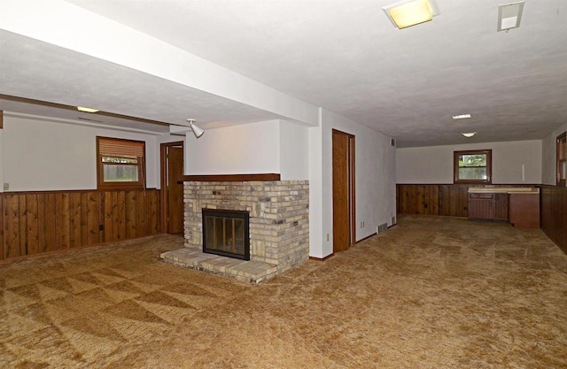 2325 Stuart Ct, Madison, WI 53704 - interior space with carpet, a wainscoted wall, wooden walls, and a fireplace