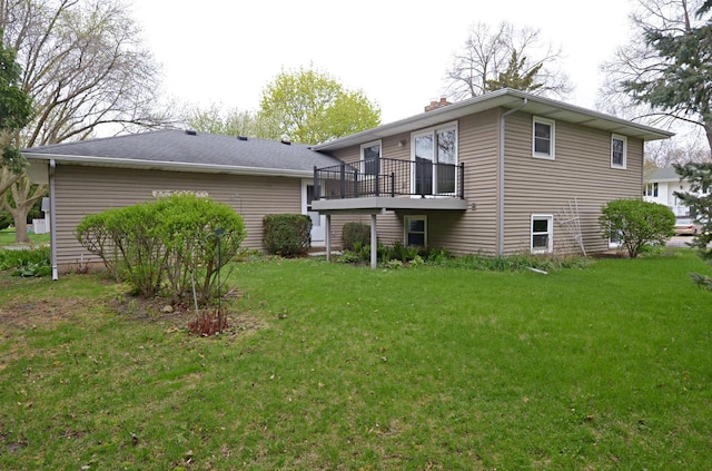 2325 Stuart Ct, Madison, WI 53704 - rear view of property with a lawn, a wooden deck, and a chimney