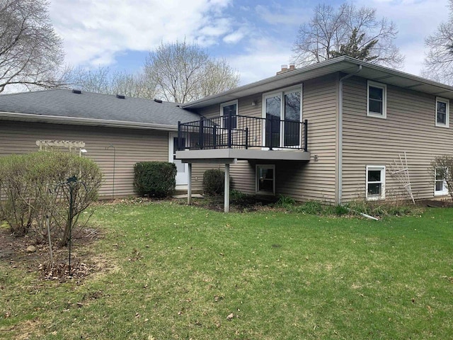 2325 Stuart Ct, Madison, WI 53704 - rear view of house with a wooden deck, a yard, and a chimney