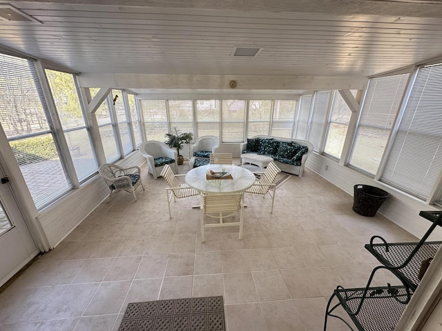 unfurnished sunroom with plenty of natural light and wood ceiling