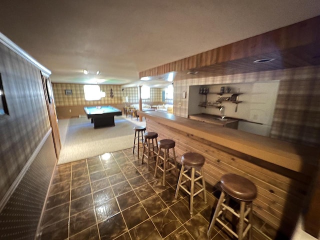 game room featuring a bar, pool table, and wallpapered walls