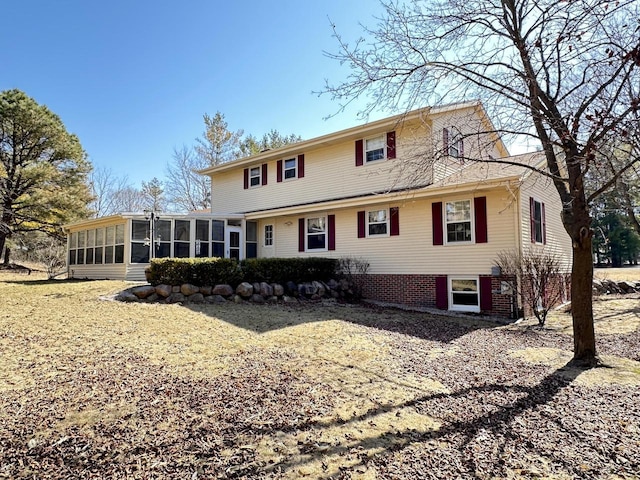 view of front of home with a sunroom