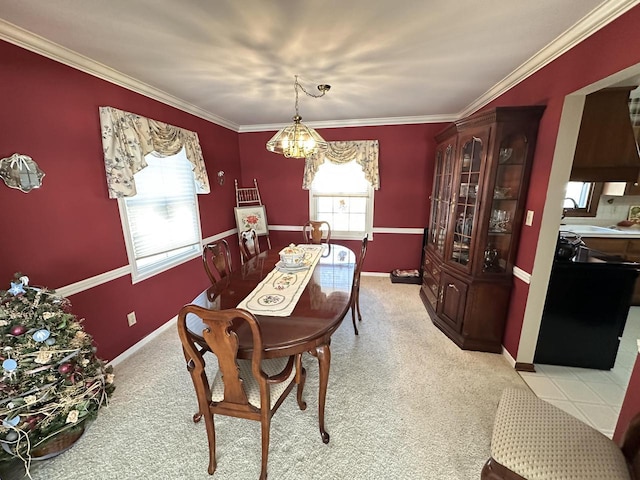 dining area featuring light colored carpet, baseboards, a notable chandelier, and ornamental molding