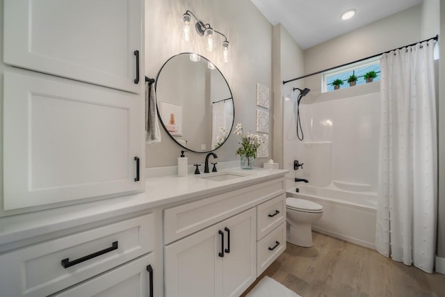 bathroom with wood finished floors, toilet, vanity, and shower / bathtub combination with curtain