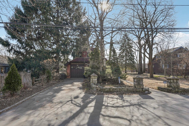 obstructed view of property featuring a garage and driveway