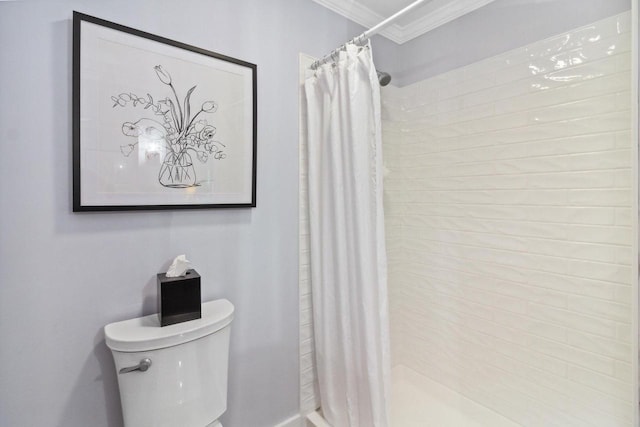 full bath with a shower stall, toilet, and ornamental molding