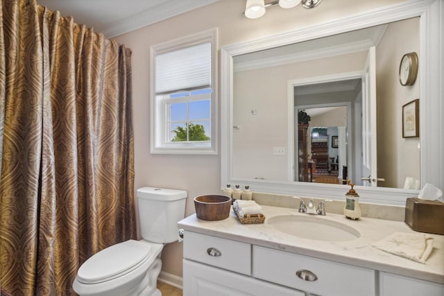 bathroom featuring vanity, toilet, and ornamental molding