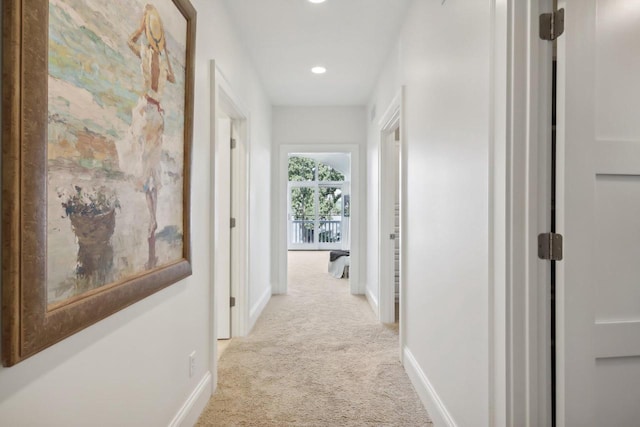 hall featuring recessed lighting, carpet, and baseboards