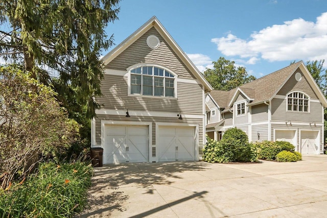 view of front of home with driveway and an attached garage