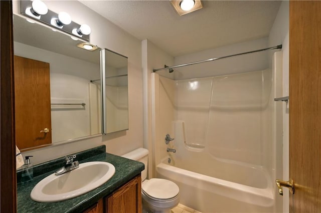 full bath featuring shower / tub combination, a textured ceiling, toilet, and vanity