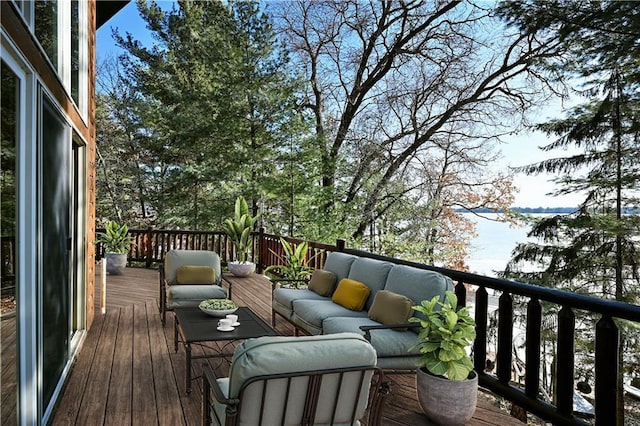 wooden terrace with an outdoor hangout area