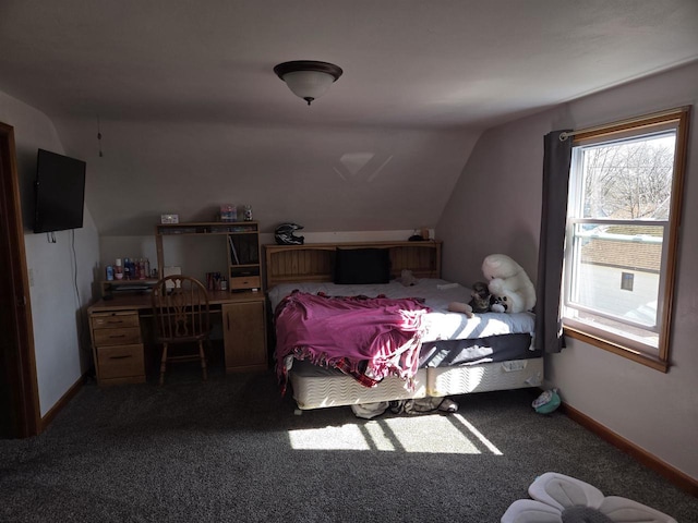 bedroom with lofted ceiling, baseboards, and carpet floors