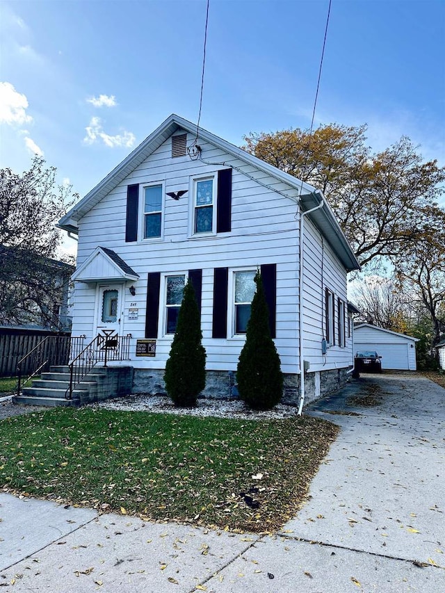 view of front of home featuring an outbuilding