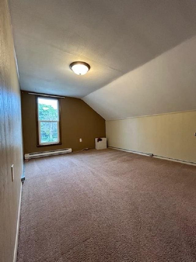 bonus room with lofted ceiling, carpet, and a baseboard radiator