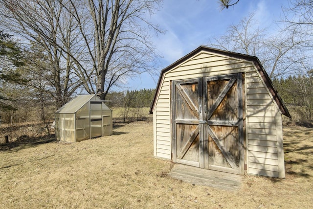 view of greenhouse featuring a storage unit