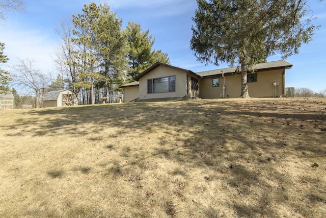 back of property with an outbuilding