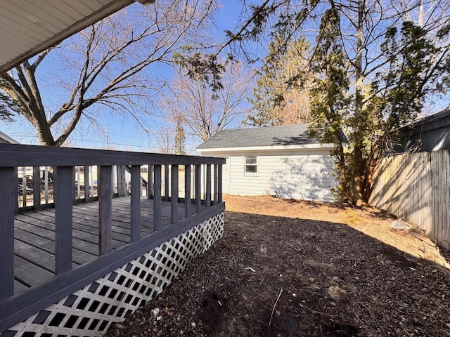 view of yard featuring a wooden deck and fence