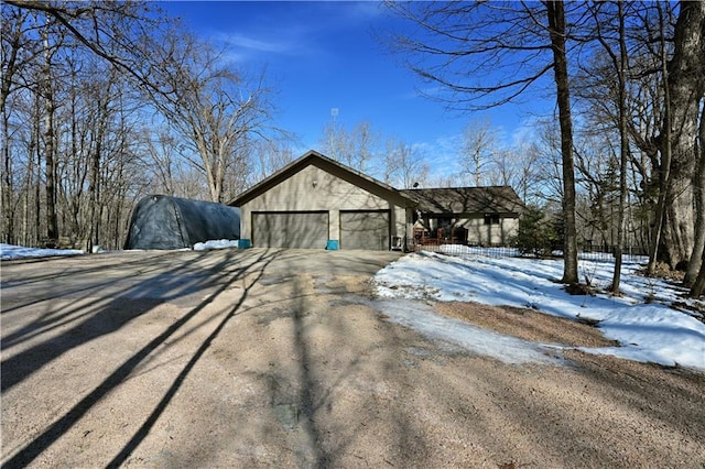 exterior space featuring an attached garage and driveway