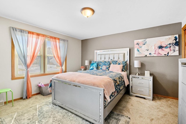 carpeted bedroom featuring baseboards