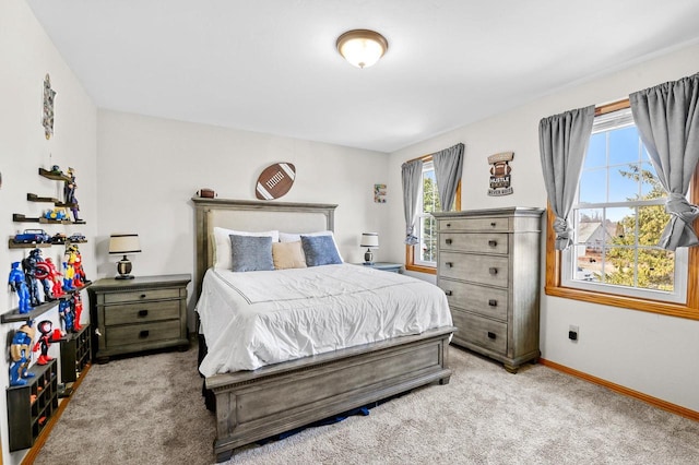 carpeted bedroom with baseboards