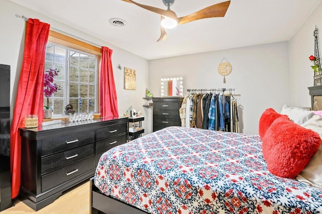 bedroom featuring visible vents and ceiling fan