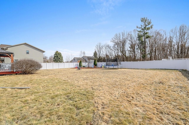 view of yard with a gazebo, a trampoline, and a fenced backyard