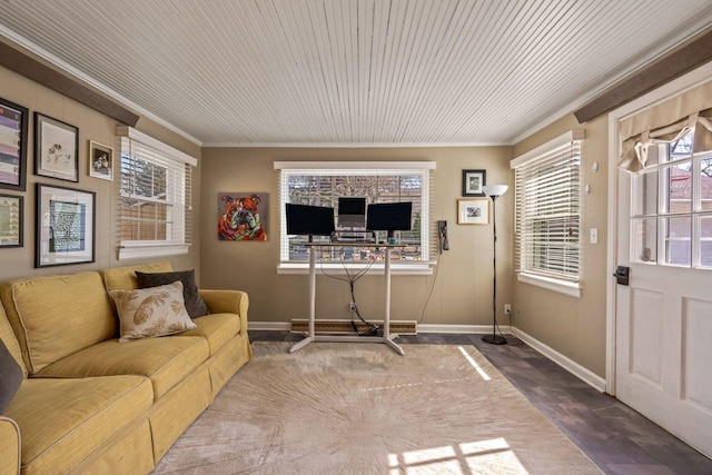 living area with wood ceiling, baseboards, and ornamental molding