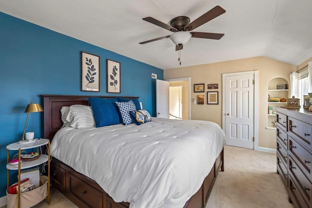 bedroom with light carpet, baseboards, a ceiling fan, and vaulted ceiling