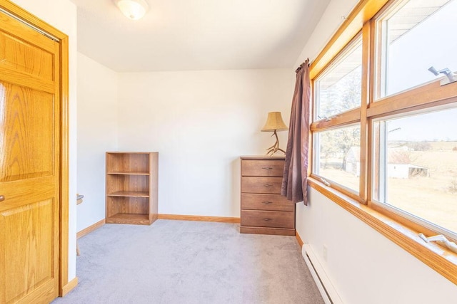 unfurnished bedroom featuring light carpet and baseboards