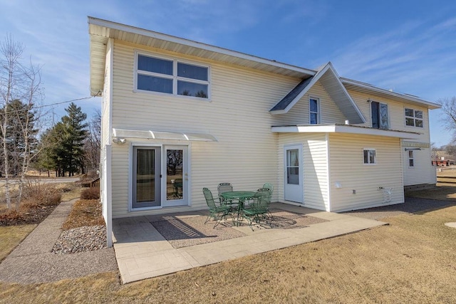 rear view of property featuring a patio area