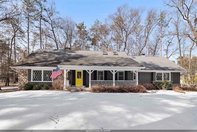 view of front of property featuring a porch and a chimney