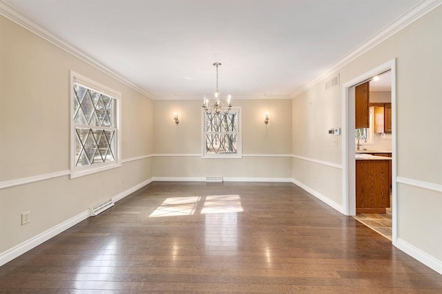 empty room featuring visible vents, dark wood-type flooring, a notable chandelier, and crown molding