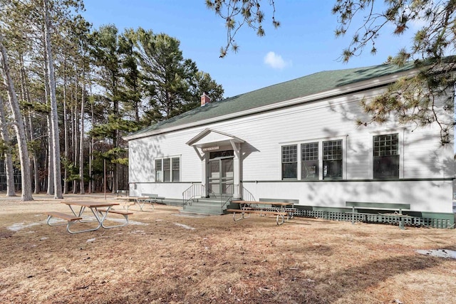 view of front of property featuring a chimney