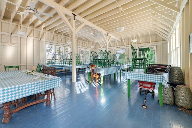 interior space featuring wood-type flooring, high vaulted ceiling, and ceiling fan