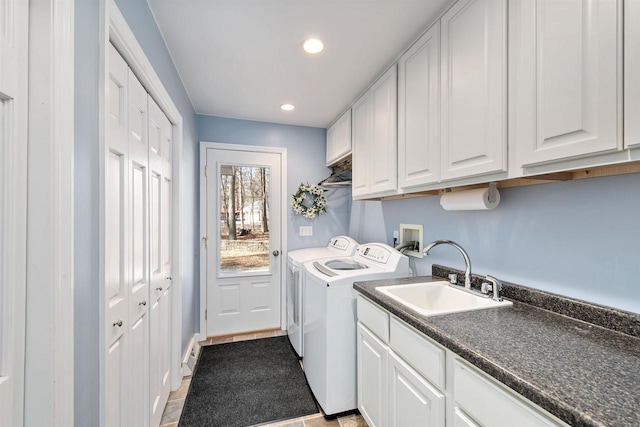 clothes washing area featuring light tile patterned floors, recessed lighting, cabinet space, a sink, and independent washer and dryer