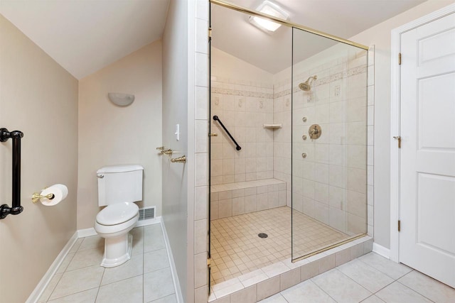 full bath featuring tile patterned floors, visible vents, a stall shower, and lofted ceiling