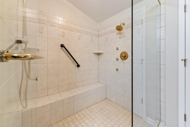 full bath with a tile shower