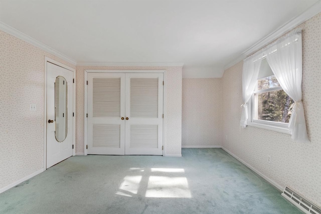 unfurnished bedroom featuring carpet, visible vents, baseboards, wallpapered walls, and crown molding