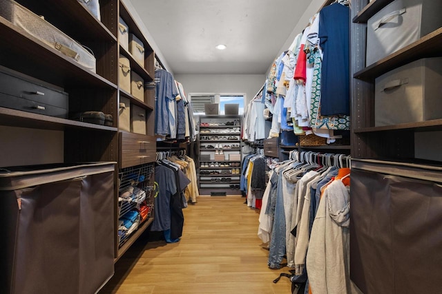 walk in closet featuring light wood-style flooring