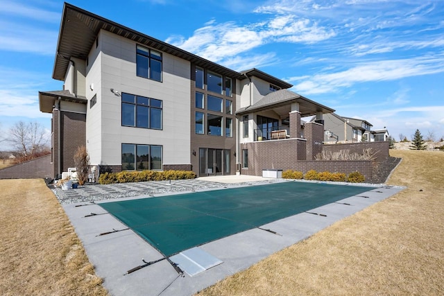 view of swimming pool with a patio