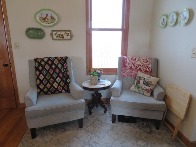 sitting room featuring wood finished floors and baseboards