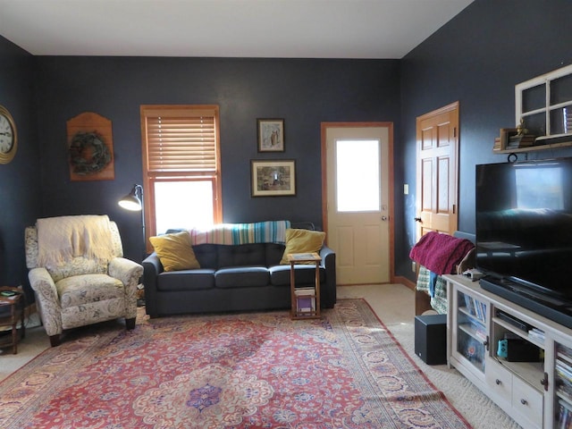 living area with light carpet